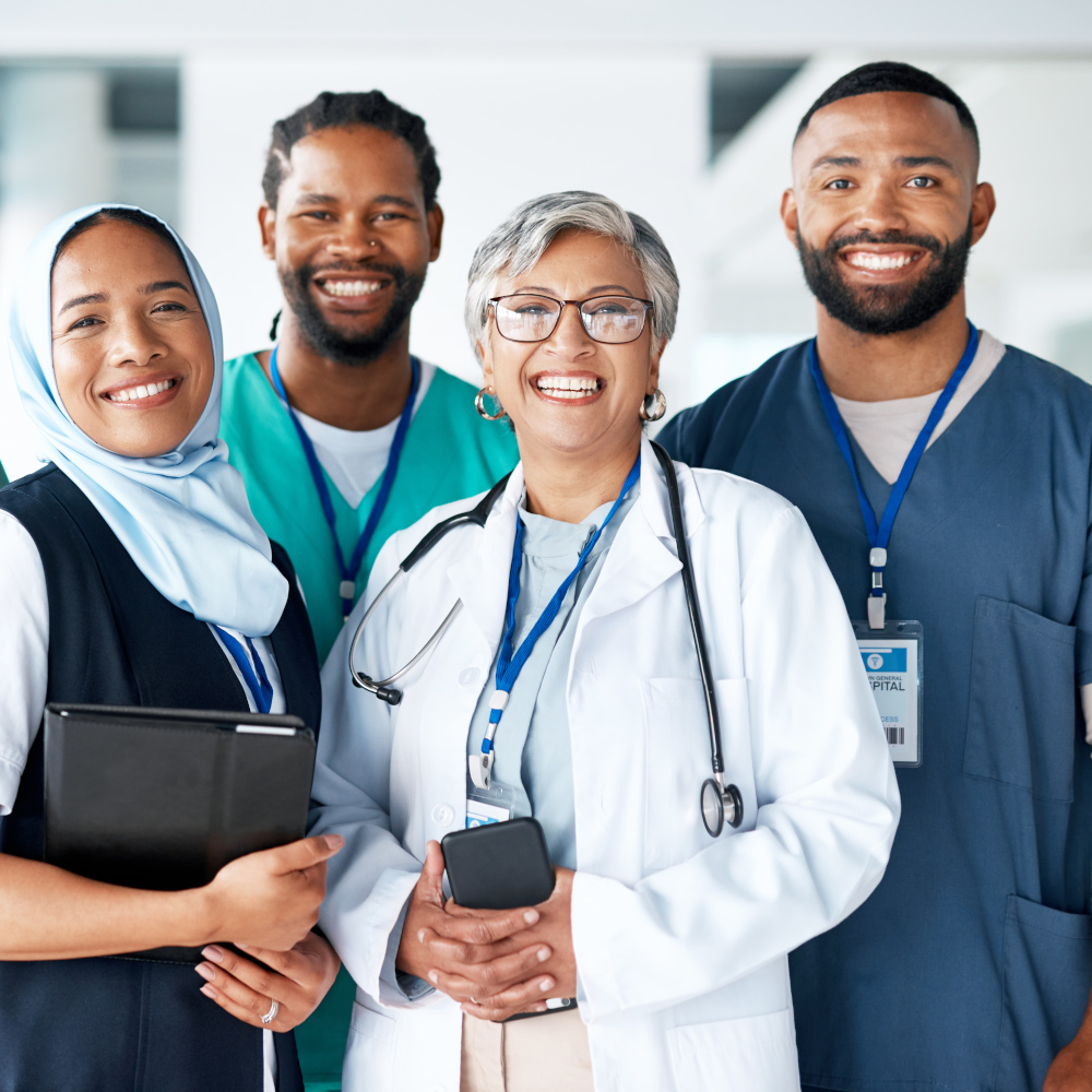 Four doctors smiling
