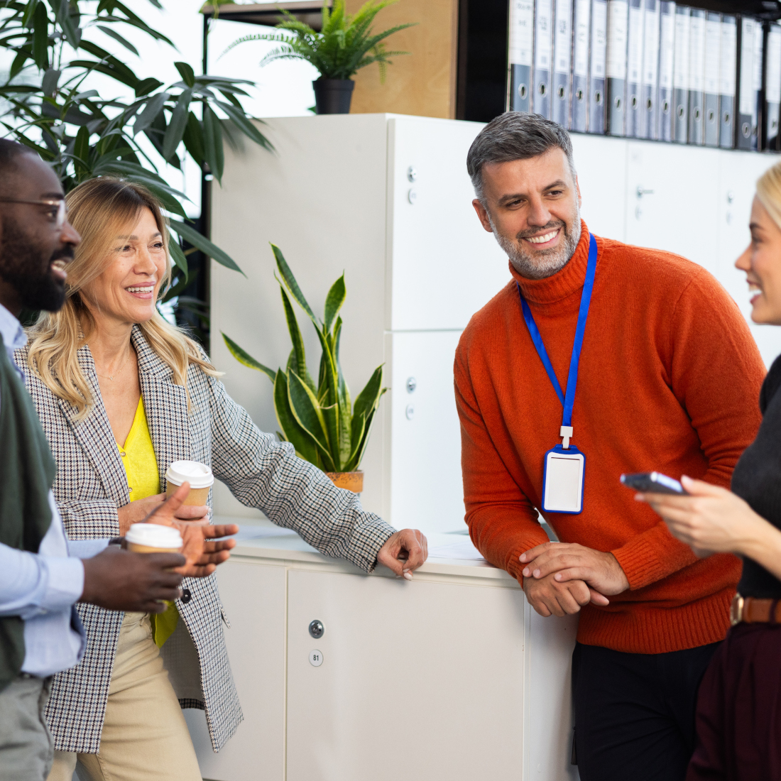 Four people talk in a circle